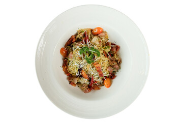 Delicious pasta dish with vegetables and fresh garnish, presented on a white plate