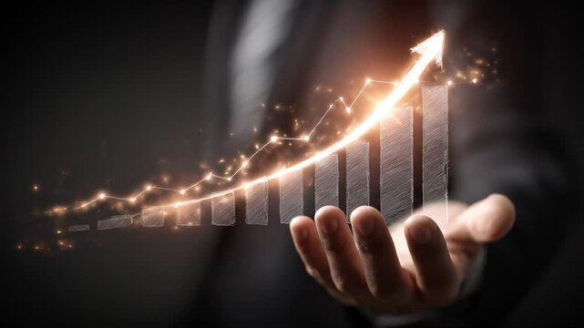A hand presents an illuminated business graph with an upward arrow, implying growth