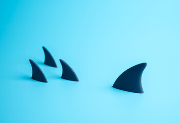 A big shark versus a group of small ones. A business concept of confrontation between business...
