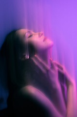 Moody Neon Portrait of Woman with Creative Lighting and Motion Blur