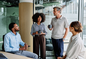 Group of young businesspeople having a meeting or presentation and seminar standing in the office....