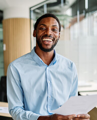 Portrait of a young businessman having a meeting in the office. Portrait of a smart young...