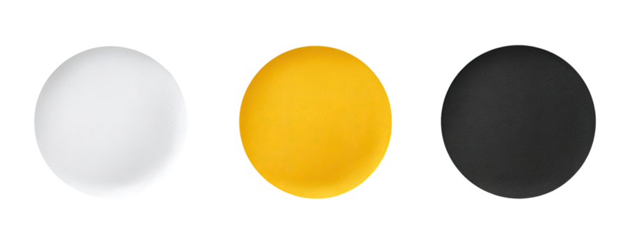 Three empty plates in white, yellow, and black
