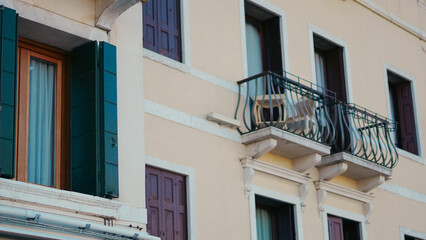 Fototapeta premium Ancient Venetian buildings close together reflecting in canal water