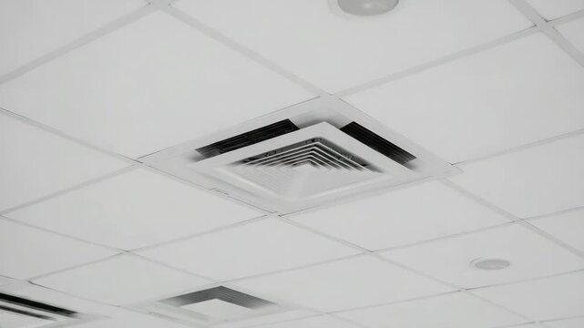 Vent for office air circulation, ceiling air vent, cooling airflow in workplace, air conditioning system, fresh air supply, vent for modern business space