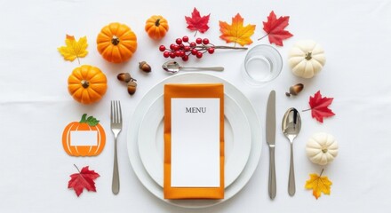 Autumn themed table setting for festive meal with pumpkins and fall leaves