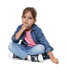 Cute little girl sitting against white background