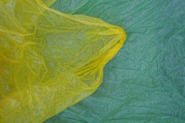 yellow green plastic texture of a piece of crumpled cellophane