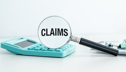 Claims concepts with calculator using magnifying glass with Claims text icon on white background.