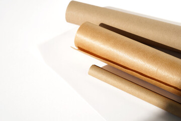 Tracing Paper, Kraft Paper Rolls Layout on White Background. Design Studio. Architect Desk.     