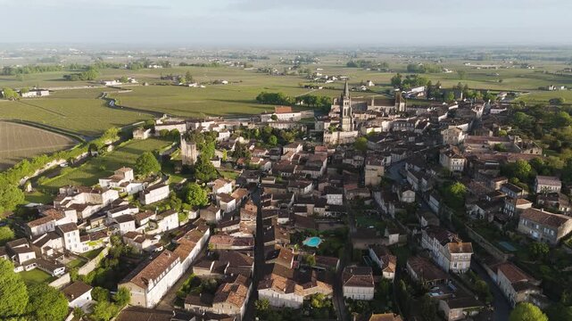 Aerial sunrise in Saint-&Eacute;milion, where fresh green vineyards awaken under soft morning light.