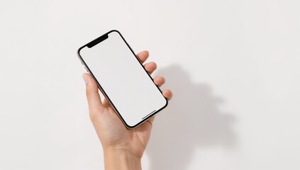 Isolated hand holding a smartphone with blank screen, ready for app or product mockup, clean white background.