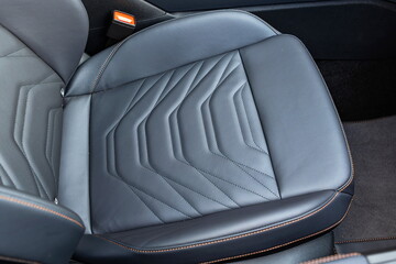 Obraz premium New, modern car black, quilted leather front passenger seat.Top down view, no people
