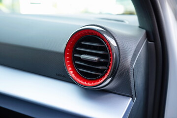 New car dashboard side air vents. Close up, wide angle shot, no people