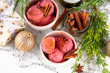 Christmas mulled wine ice cream. Two ceramic bowls with tasty mulled wine spices gelato, made from...