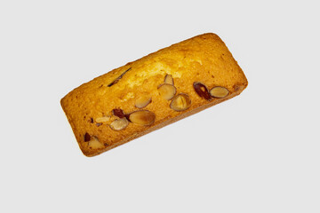 a pice of almond cake on white background .