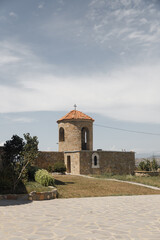Charming Stone Chapel with Orange Roof in Serene Landscape