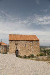 Scenic Stone Building with Orange Roof in Natural Landscape