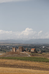 A Beautiful Scenic View of Ancient Ruins Set Against a Dramatic Sky