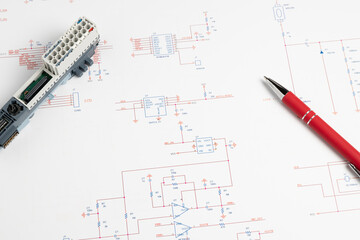 Electronic circuit diagram with component and red pen
