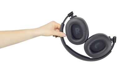headphones in hand, concept to pass or discard headphones	