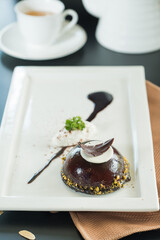 Exquisite chocolate dessert artfully presented on a pristine plate, showcasing fine dining elegance