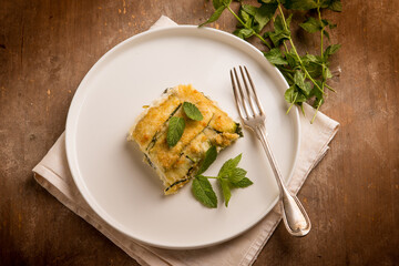 Zucchini flan with cheese and mint leaves