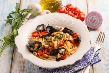 spaghetti with mussels tomatoes and parsley