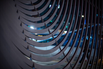 Abstract Curved Metal Bars with City Lights