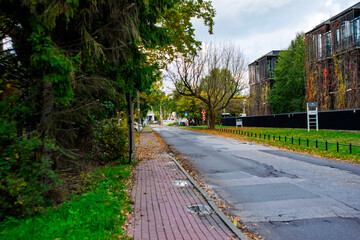 October 19, 2025, Warsaw, Poland: A pathway in an urban park blocked by red and white barriers and a 