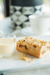 Delicious cake with nuts, milk glass and a cup of coffee ready to be enjoyed