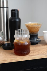 cold brew coffee with ice on wooden tablle