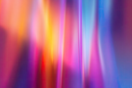 Vivid blur neon pink red orangeblue purple rainbow color gradient abstract background. Light through a prism
