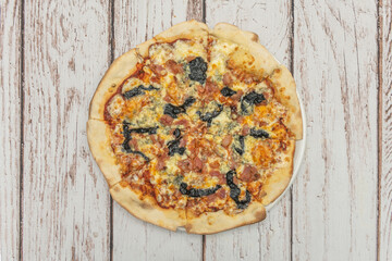 Sundried Tomato Pizza with hydrated sundried tomatoes, confit garlic, basil, and pine nuts