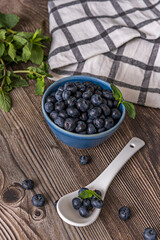 Ripe blueberries ready to harvest on a wooden background