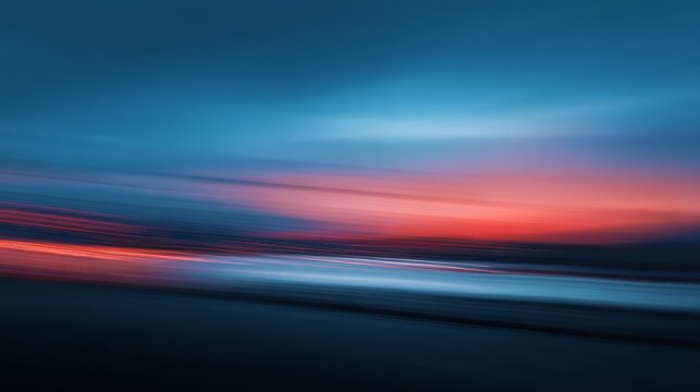 Abstract motion blur streaks depict a colorful horizon at dusk.