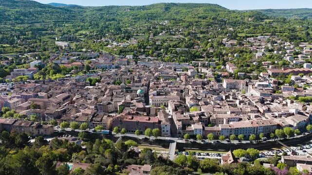 Aerial view of a southern France village &mdash; tiled roofs, warm light, and timeless Mediterranean charm.