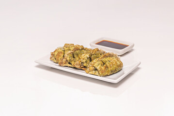 Crispy gyozas filled with seasonal vegetables, rice noodles, and vegetarian oyster sauce