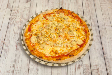Mediterranean pizza with cherry tomatoes, Kalamata olives, crumbled feta cheese, and fresh Greek oregano