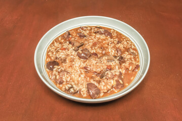 Rabbit and romesco paella, with the traditional Catalan sauce integrated into the rice