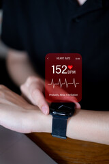Person using smartwatch technology to monitor heart attack arrythmia alert detection health prevention heartbeat innovation pulse wellness cardiogram health care fitness lifestyle electronic sensor
