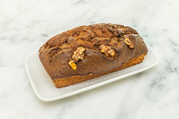 Chocolate and hazelnut sponge cake with homemade praline between layers and caramelized hazelnut decoration