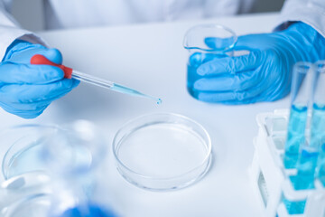 Professional young Asian woman scientist working biochemistry laboratory science research experiment chemistry technology innovation analysis biology biotechnology microbiology discovery examining