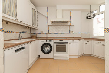 Minimalist kitchen with high-end handleless cabinets, granite countertops, and a smart interior organization system