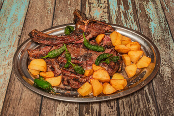 crusted beef sirloin, accompanied by confit ratte potatoes clarified butter