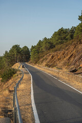 A mountain road with hairpin bends that skirt deep ravines covered in   vegetation, where the humidity creates unique microclimates on the slopes.