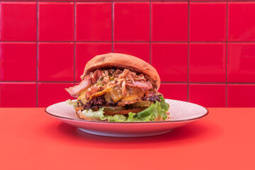 Homemade burger creation with a brioche bun, our own ground beef, and garden vegetables, with a...