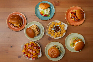 Close-up of the sesame-seed brioche bun on a burger with a perfectly cooked beef patty.