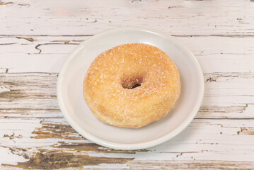 Traditional American-Style Donuts: Fluffy dough fried to perfection and dusted with finely sifted powdered sugar.