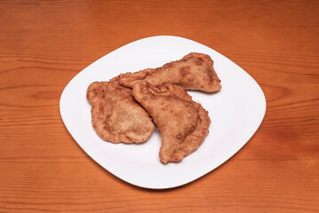 Goat cheese and caramelized onion empanadas, puff pastry, served with fig jam